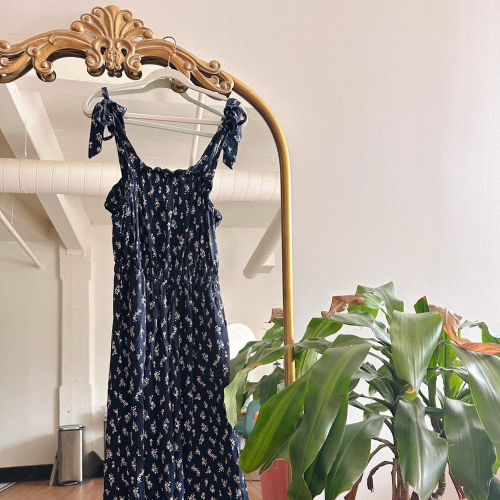 Francesca's Navy Floral Wide Leg Jumpsuit w/ Bow Tie Straps